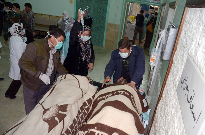 In this image made available by the Syrian News Agency (SANA) on March 19, 2013, people are brought into a hospital in the Khan al-Assal region in the northern Aleppo province, as Syria's government accused rebel forces of using chemical weapons for the first time. (AFP/SANA)