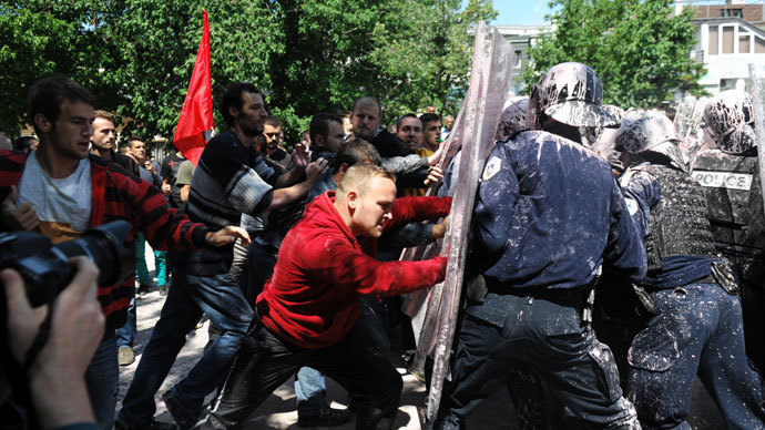 Kosovo Police splashed with paint clash with demonstrators in Pristina on June 27, 2013.(AFP Photo / Armend Nimani)