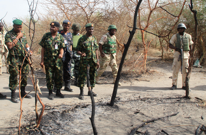 Members of the Nigerian Defence headquarter team inspecting an alleged Boko Haram base in Kirenowa (AFP Photo)