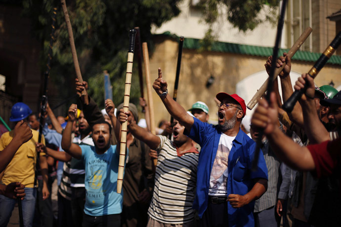 Supporters of Egyptian President Mohamed Morsi shout slogans during a protest around the Raba El-Adwyia mosque square in Nasr City, a suburb of Cairo, June 30, 2013 (Reuters)