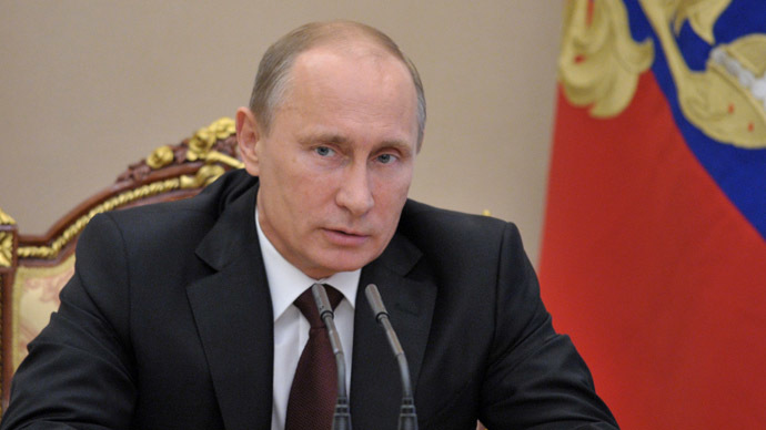 Putin signs 'gay propaganda' ban and law criminalizing insult of religious feelings