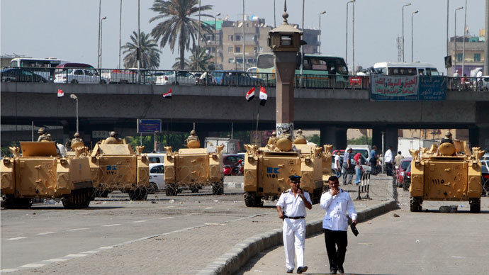 Egyptian army soldiers guard with armoured personnel carriers (APC) near Tahrir Square in Cairo August 19, 2013.(Reuters / Mohamed Abd El Ghany)