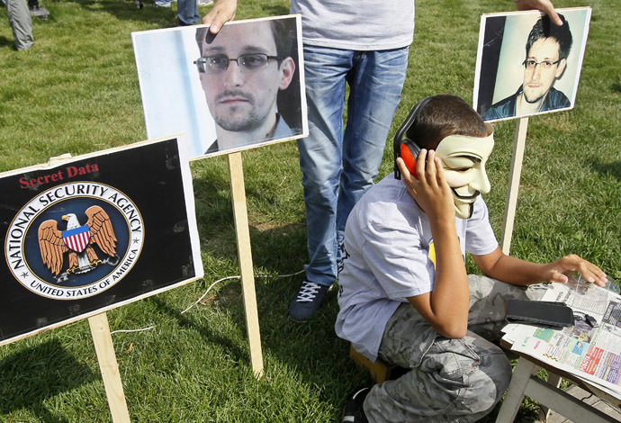 Activists from the Internet Party of Ukraine perform during a rally supporting Edward Snowden, a former contractor at the National Security Agency (NSA), in front of U.S. embassy, in Kiev June 27, 2013. (Reuters)