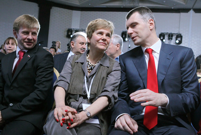 From left: Yevgeny Urlashov, member of the Civic Platform's federal civic committee, Irina Prokhorova, chief editor of the New Literary Observer publishing house, and the leader of the Civic Platform party Mikhail Prokhorov at the party's conference. (RIA Novosti)