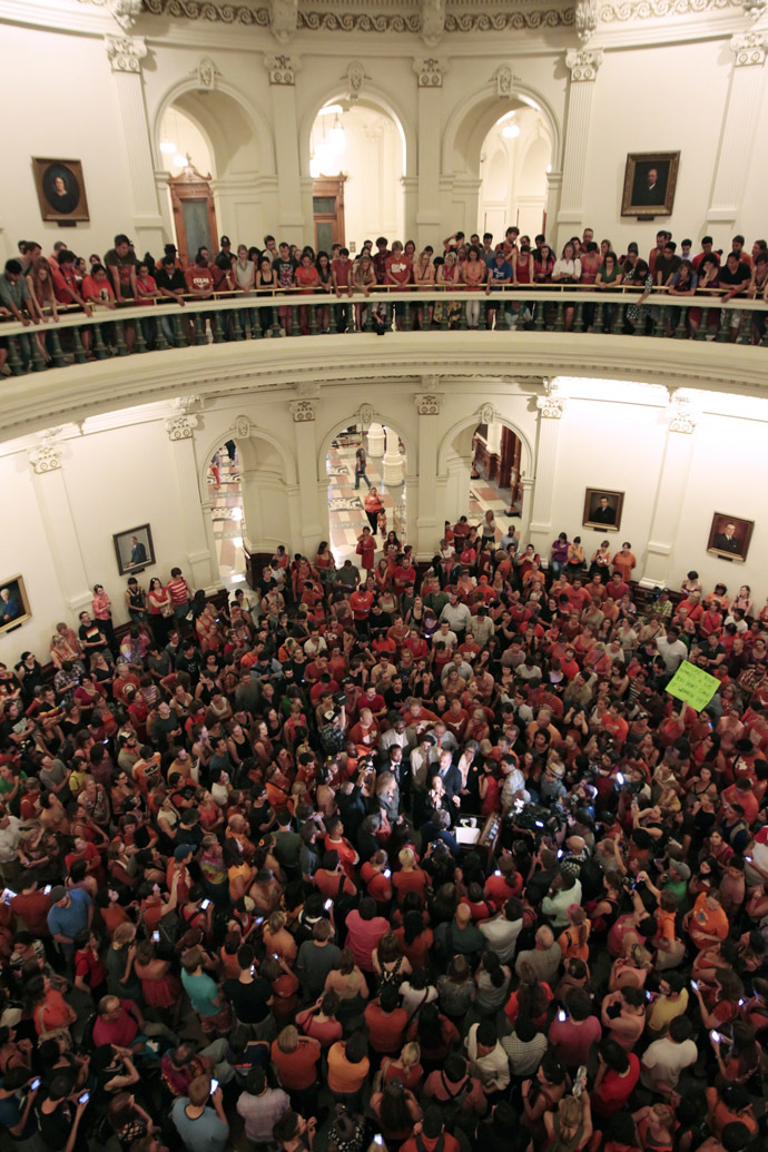 Reproductive rights advocates fill the Texas capitol rotunda celebrating the defeat of the controversial anti-abortion bill SB5, which was up for a vote on the last day of the legislative special session June 25, 2013 in Austin, Texas. (Erich Schlegel/Getty Images/AFP)