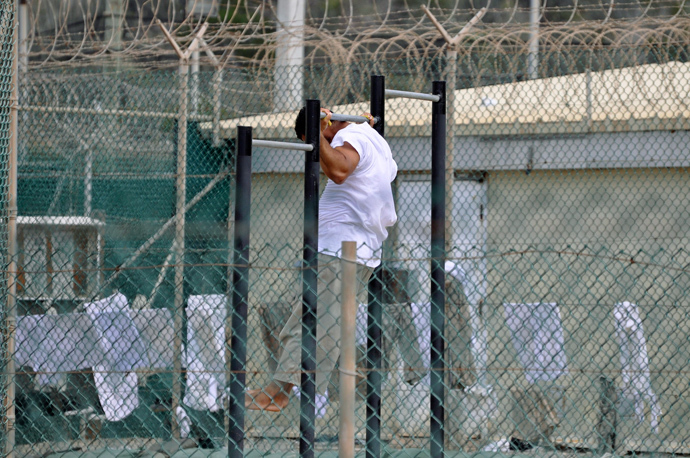 Guantanamo detainee does pull-ups inside an exercise area at the detention facility at Guantanamo Bay U.S. Naval Base (Reuters / Michelle Shephard / Pool)