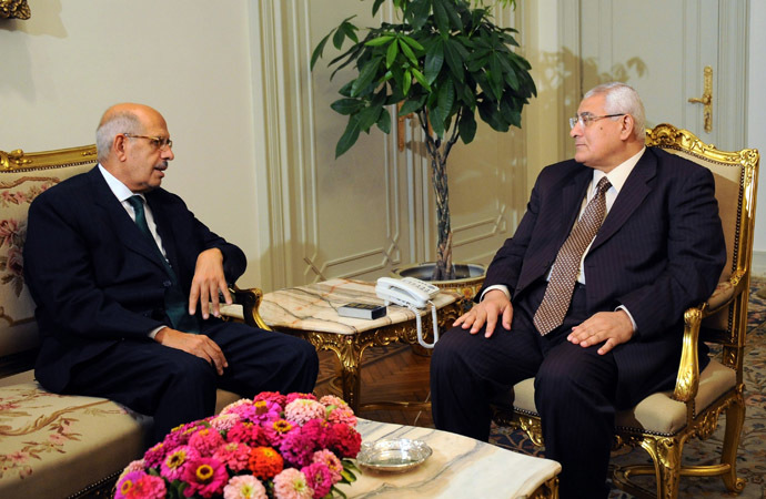 A handout picture released by the Egyptian Presidency shows Egypt's interim president Adly Mansour (R) meeting with newly appointed Prime Minister and opposition National Salvation Front leader Mohamed El Baradei (L) in Cairo on July 6, 2013. (AFP Photo/Egyptian Presidency)