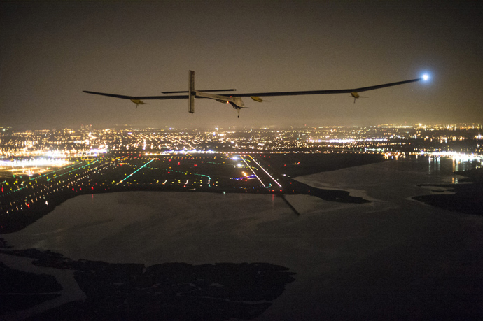 This handout picture show the experimental Solar Impulse HB-SIA plane with Andre Borschberg onboard approaching JFK airport on late July 6, 2013 in New York (AFP Photo / Jean Revillard)
