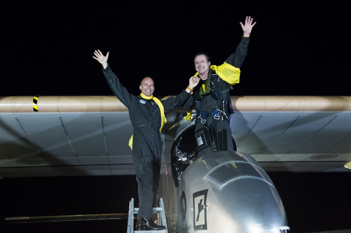 This handout picture shows Solar Impulse Chairman and pilot Bertrand Piccard (L) and Solar Impulse CEO and pilot Andre Borschberg posing after Solar Impulse HB-SIA planes landed in JFK airport on late July 6, 2013 in New York (AFP Photo / Fred Merz)