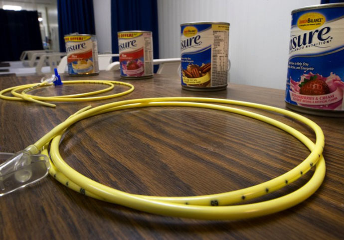 In this photo reviewed by US military officials, two feeding tubes and cans of Ensure with flavors such as Butter Pecan and Strawberries & Cream are seen inside the detainee hospital inside Camp Delta, part of the US Detention Center at Guantanamo Bay, Cuba (AFP Photo / Paul J. Richards)