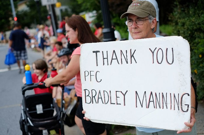 A woman shows her support for Bradley Manning during the Independence Day parade in Takoma Park, Maryland on July 4, 2013. (AFP Photo / Mandel Ngan)