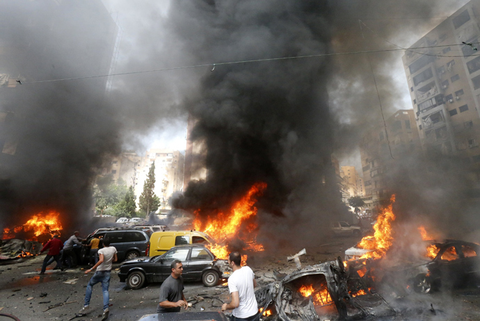 Civilians gather at the of an explosion in Beirut's southern suburb neighbourhood of Bir al-Abed on July 9, 2013 (AFP Photo / Str) 