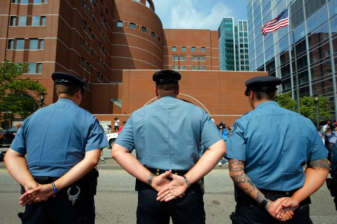 Massachusetts Institute of Technology (MIT) police officers stand outside the federal courthouse for the court appearance by accused Boston Marathon bomber Dzhokhar Tsarnaev in Boston, Massachusetts July 10, 2013 (Reuters / Brian Snyder)