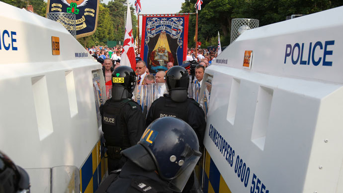 Police in riot gear stop protestant Orangemen from marching through the Catholic Ardoyne district of north Belfast, Northern Ireland, on July 12, 2013.(AFP Photo / Peter Muhly)