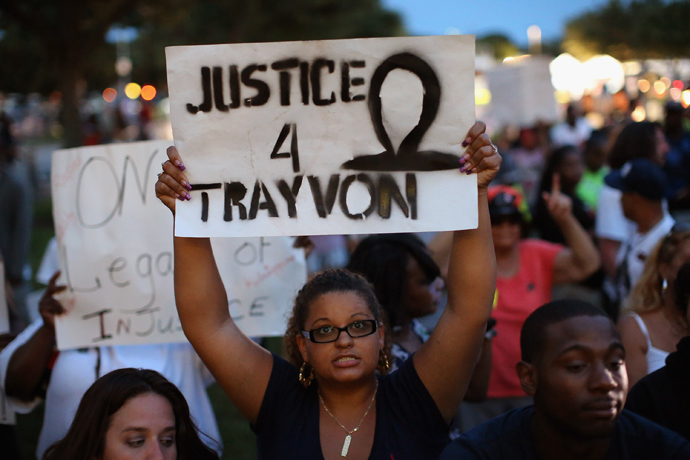 Supporters of Trayvon Martin wait in front of the Seminole County Criminal Justice Center for the verdict to be announced in the George Zimmerman murder trial on July 13, 2013 in Sanford, Florida (AFP Photo / Scott Olson)