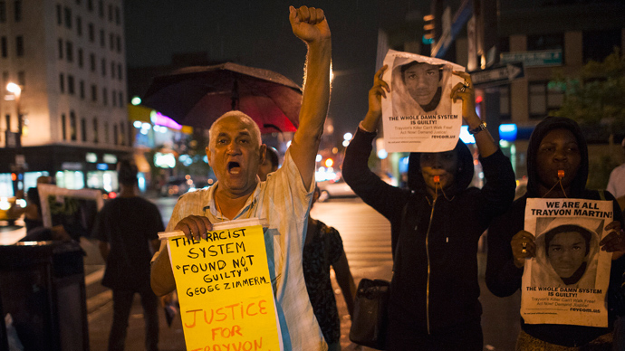 Protesters gesture as they rally in response to the acquittal of George Zimmerman in the Trayvon Martin trial, in the Harlem neighborhood of New York July 14, 2013 (Reuters / Keith Bedford)