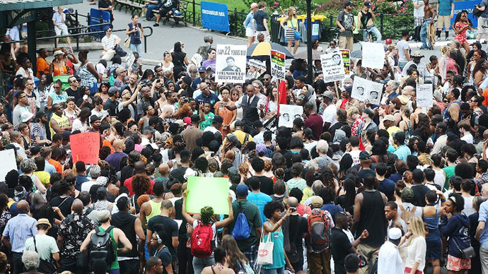 People gather at a rally honoring Trayvon Martin at Union Square in Manhattan on July 14, 2013 in New York City. (AFP Photo / Mario Tama)