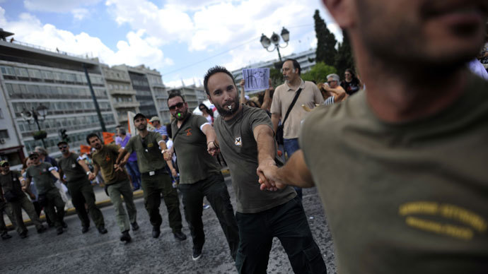 Municipal police members demonstrate on July 16, 2013 in front of the parliament during a general strike in Athens. (AFP Photo / Aris Messinis)