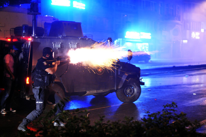 Riot police fires tear gas bomb to disperse protesters at Harbiye near Taksim square in Istanbul, on June 16, 2013. (AFP Photo/Ozan Kose)
