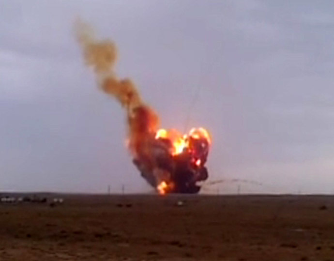 The Proton-M carrier-rocket with its DM-03 upper stage and three Russian Glonass-M satellite navigation systems seen falling down after its take-off from the Baikonur space center. (RIA Novosti/Yuri Aliseenko)