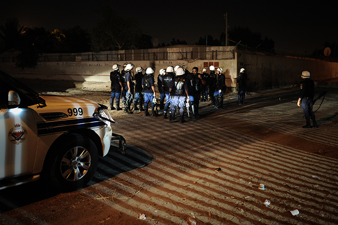 Bahraini policemen gather during clashes with demonstrators following a protest to demand more rights and against the ruling regime in the village of Diraz, West of Manama, in the early hours of July 19, 2013. (AFP Photo / Mohammed Al-Shaikh)