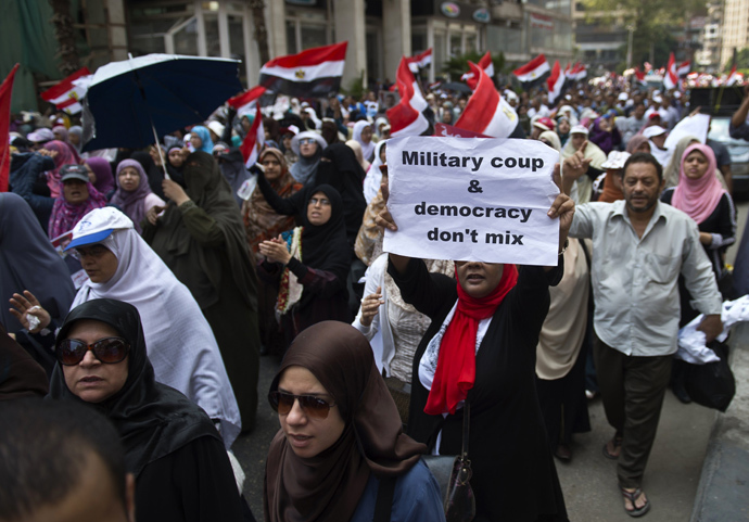 Supporters of the Muslim Brotherhood and ousted Egyptian president Mohamed Morsi march towards Cairo University to demand his reinstatement in Cairo on July 19, 2013 (AFP Photo / Khaled Desouki) 