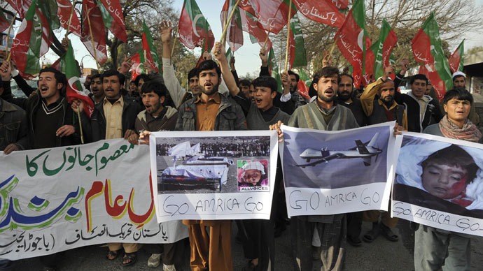 Supporters of Pakistani cricketer turned politician Imran Khan of Pakistan Tehreek-i-Insaaf (PTI - Movement for Justice) hold placards as they shout anti-US slogans during a protest in Islamabad.(AFP Photo / Aamir Qureshi)