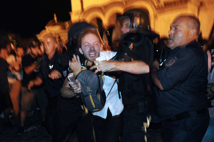 Bulgarian riot policemen push a protestor during an anti-government protest in Sofia on July 23, 2013. (AFP Photo/Dimitar Dilkoff)