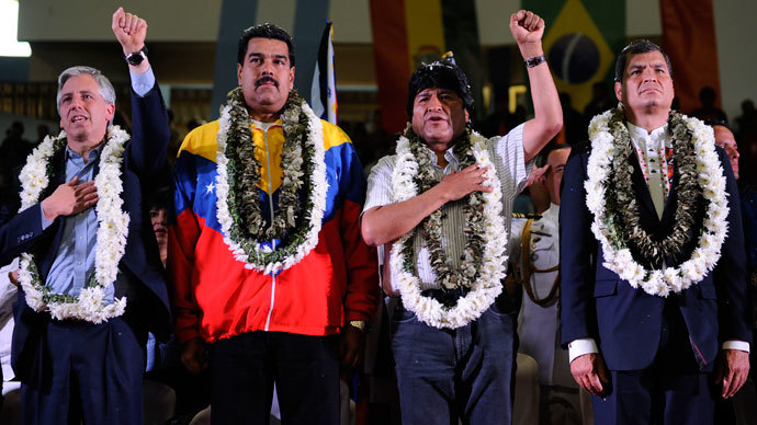  (L-R) Bolivia's Vice-President Alvaro Garcia Linera, Venezuela's President Nicolas Maduro, Bolivia's President Evo Morales (L) and Ecuador's President Rafael Correa listen to the Bolivian national anthem during a welcoming gathering in honour of Morales, in Cochabamba, on July 4, 2013.(AFP Photo / Jorge Bernal)