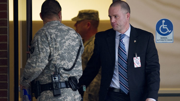 David Coombs (R), defense attorney for US Army Private First Class Bradley Manning, exits the building at a US military Magistrate Court facility for an Article 32 hearing at Fort Meade, Maryland on December 19, 2011.(AFP Photo / Jim Watson)