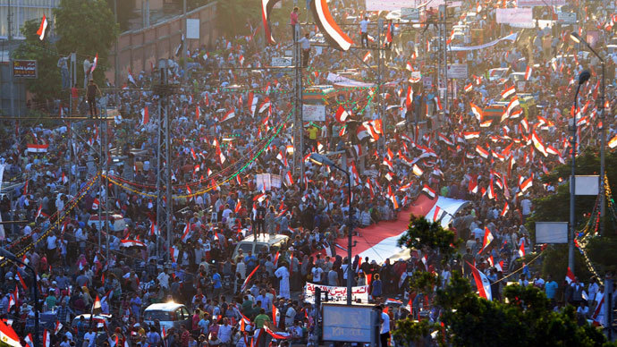 Anti-Mursi protesters shout slogans as they wave Egyptian national flags during a rally and march around El-Thadiya presidential palace in Cairo July 26, 2013.(Reuters / Amr Abdallah Dalsh)