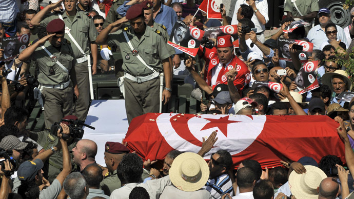 Tear gas, clashes in Tunisia after funeral of slain opposition leader draws thousands