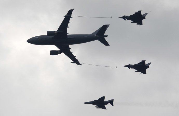 An Airbus A310 MRTT tanker transport aircraft (L) prepares to refuel two Eurofighter jets (R) as they are accompanied by a Tornado fighter jet at the ILA International Air Show in Schoenefeld south of Berlin (Reuters/Fabrizio Bensch )