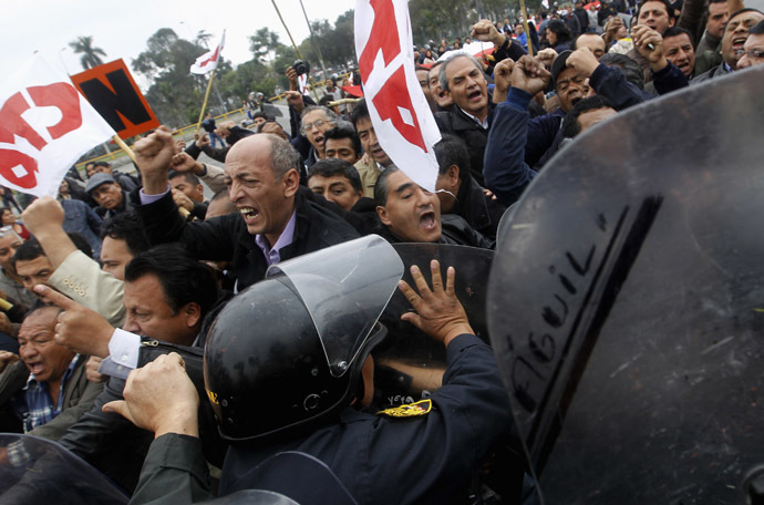 Peruvian special police control protesters during a march against the government in Lima July 27, 2013. (Reuters/Mariana Bazo)