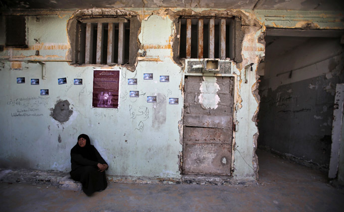 A Palestinian woman sits at Saraya prison that had been used by Israeli security services to keep Palestinian prisoners during Israel's occupation of Gaza Strip (Reuters/Suhaib Salem)
