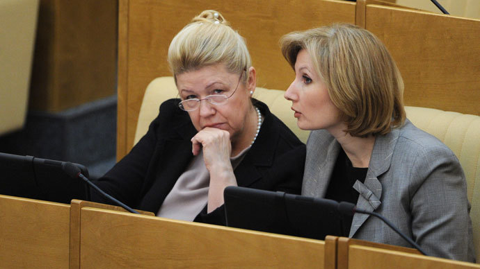 Olga Batalina, First Deputy Chair of the State Duma Committee on Family, Women and Children's Issues, and Yelena Mizulina, Chair of the State Duma Committee on Family, Women and Children's Issues, (right to left) at a State Duma plenary session.(RIA Novosti / Vladimir Fedorenko)