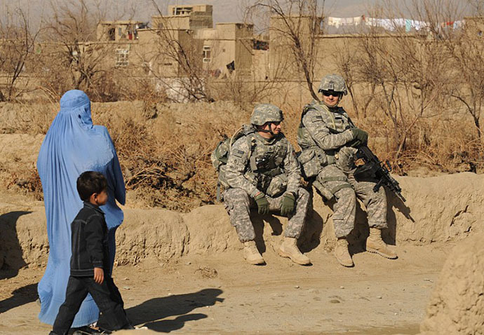 US soldiers belonging to the NATO-led International Security Assistance Force (ISAF) as they keep watch during a patrol in a village outside Bagram Air base, some 50 kms north of Kabul (AFP Photo / Shan Marai)