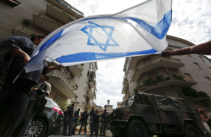 People hold an Israeli flag during a protest against convicted former Nazi SS captain Erich Priebke in front of his residence in Rome July 29, 2013. (Reuters)