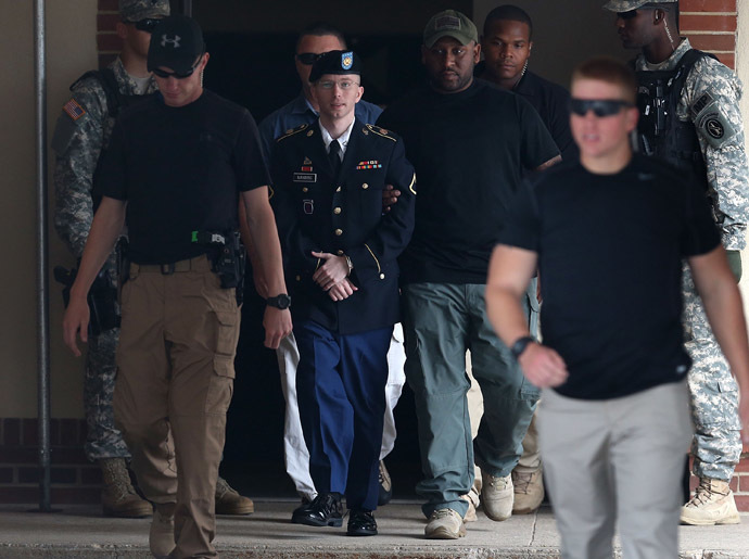 U.S. Army Private First Class Bradley Manning (C) is escorted by military police as he leaves his military trial after he was found guilty of 20 out of 21 charges, July 30, 2013 Fort George G. Meade, Maryland. (Mark Wilson/Getty Images/AFP)