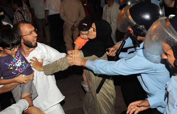 Angry protesters stage a demonstration on August 2, 2013 in Rabat-Morocco, to protest the release of a Spanish paedophile, Daniel Fino Galvan who raped 11 local children was pardoned by the Moroccan King Mohammed VI. (AFP Photo/Fadel Senna)