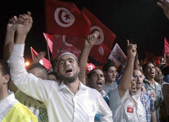 Tunisian supporters of ruling Islamist Ennahdha party chant slogans on August 3, 2013 in Tunis in solidarity with the government. (AFP Photo/Fethi Belaid)