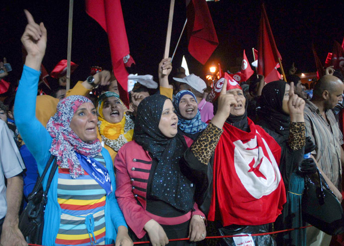 Tunisian supporters of ruling Islamist Ennahdha party chant slogans on August 3, 2013 in Tunis in solidarity with the government. (AFP Photo/Fethi Belaid)