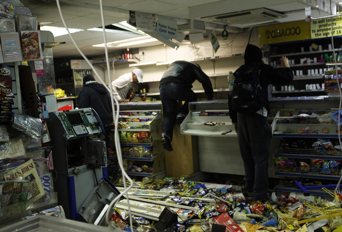 Looters rampage through a convenience store in Hackney, east London August 8, 2011 (Reuters)