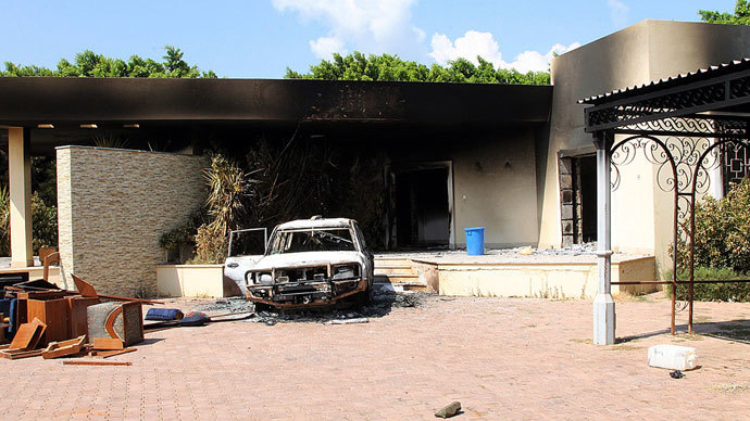  A burnt house and a car are seen inside the US Embassy compound on September 12, 2012 in Benghazi, Libya following an overnight attack on the building. The US ambassador to Libya and three of his colleagues were killed in an attack on the US consulate in the eastern Libyan city by Islamists outraged over an amateur American-made Internet video mocking Islam, less than six months after being appointed to his post.(AFP Photo / Stringer)
