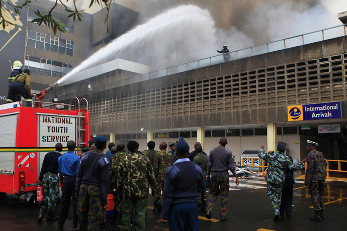Fire fighters struggle to put out a fire at the Jomo Kenyatta International Airport in Kenya's capital Nairobi August 7, 2013 (Reuters / Noor Khamis)