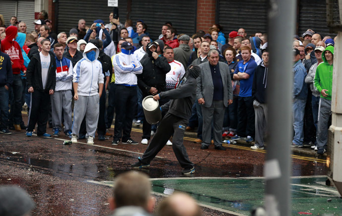 Loyalist protesters attack the police as they wait for a republican parade to make its way through Belfast City Centre, August 9, 2013. (Reuters/Cathal McNaughton)