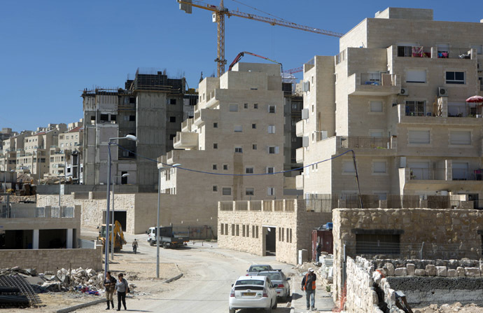 Labourers work at a housing construction site in the Israeli settlement of Har Homa in east Jerusalem (AFP Photo/Menahem Kahana)