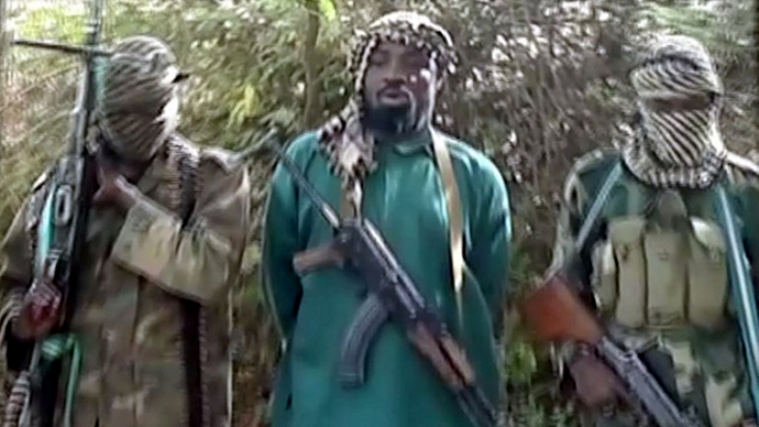 A picture taken from a video distributed to Nigerian journalists in the country's north reportedly shows the suspected leader of Nigerian Islamist extremist group Boko Haram (AFP Photo)