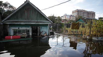 Resident of Russia's flooded Far East won't evacuate to stay with her cats and books