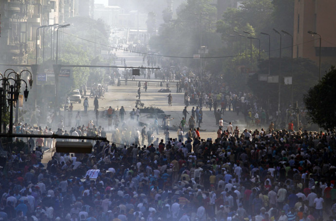 Supporters of the Muslim Brotherhood and Egypt's ousted president Mohamed Morsi gather in Cairo's Abbassiya neighbourhood on August 16, 2013. (AFP Photo/Mohammed Abdel Moneim) 